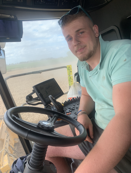 Angus Fox sitting in the cab of a tractor